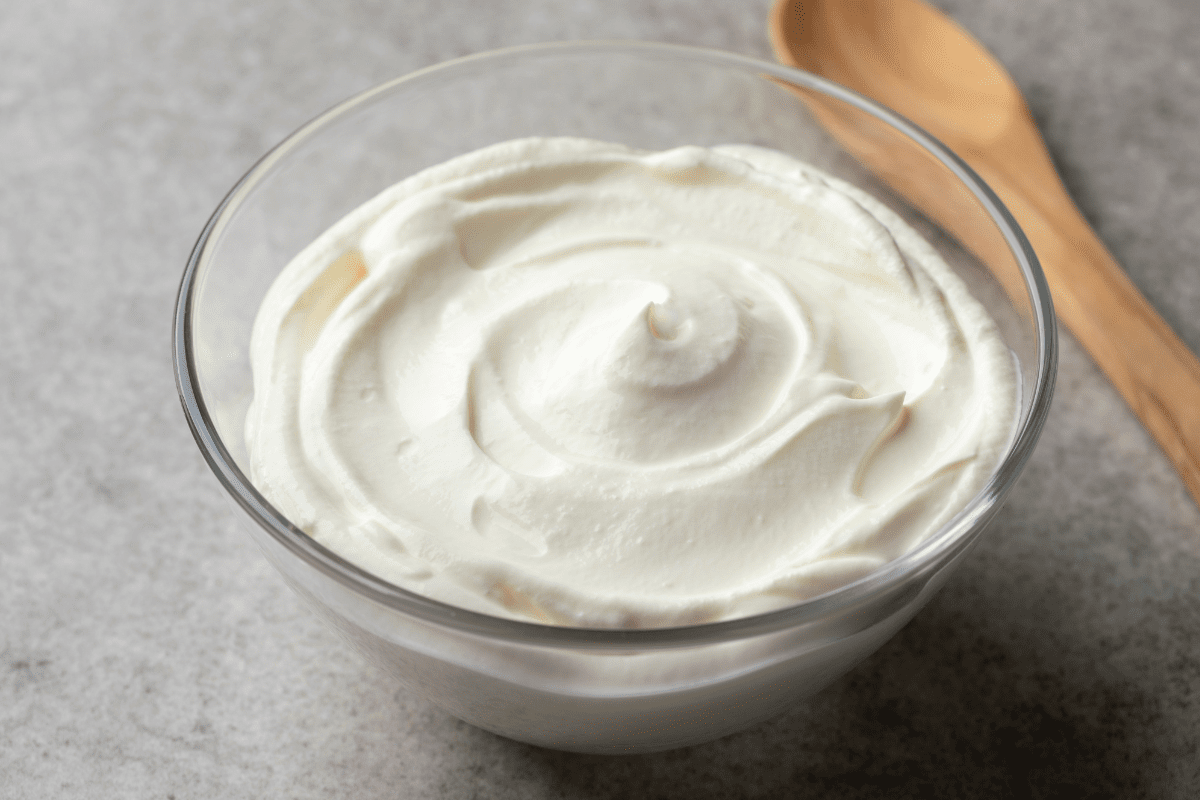Brazilian cream cheese in glass bowl with wooden spoon