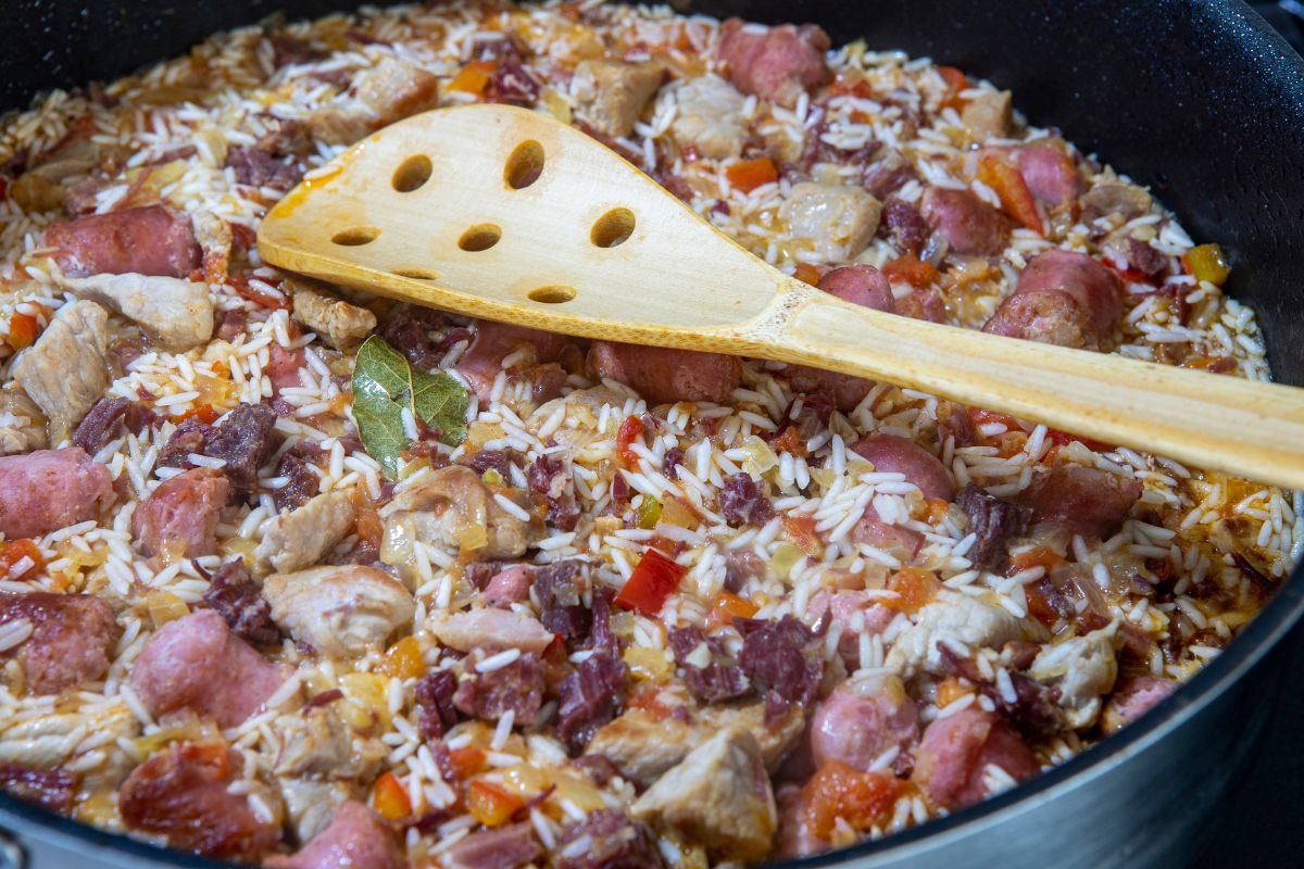 Pot of arroz carreitero, long grain Brazilian rice with leftover barbecue meats